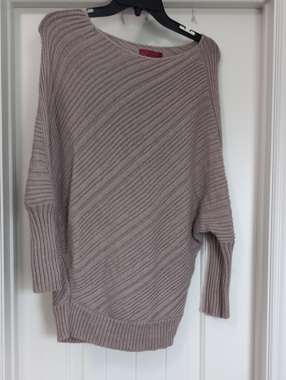 Jennifer Lopez Off-the-Shoulder Ribbed Knit Sweater in Taupe
